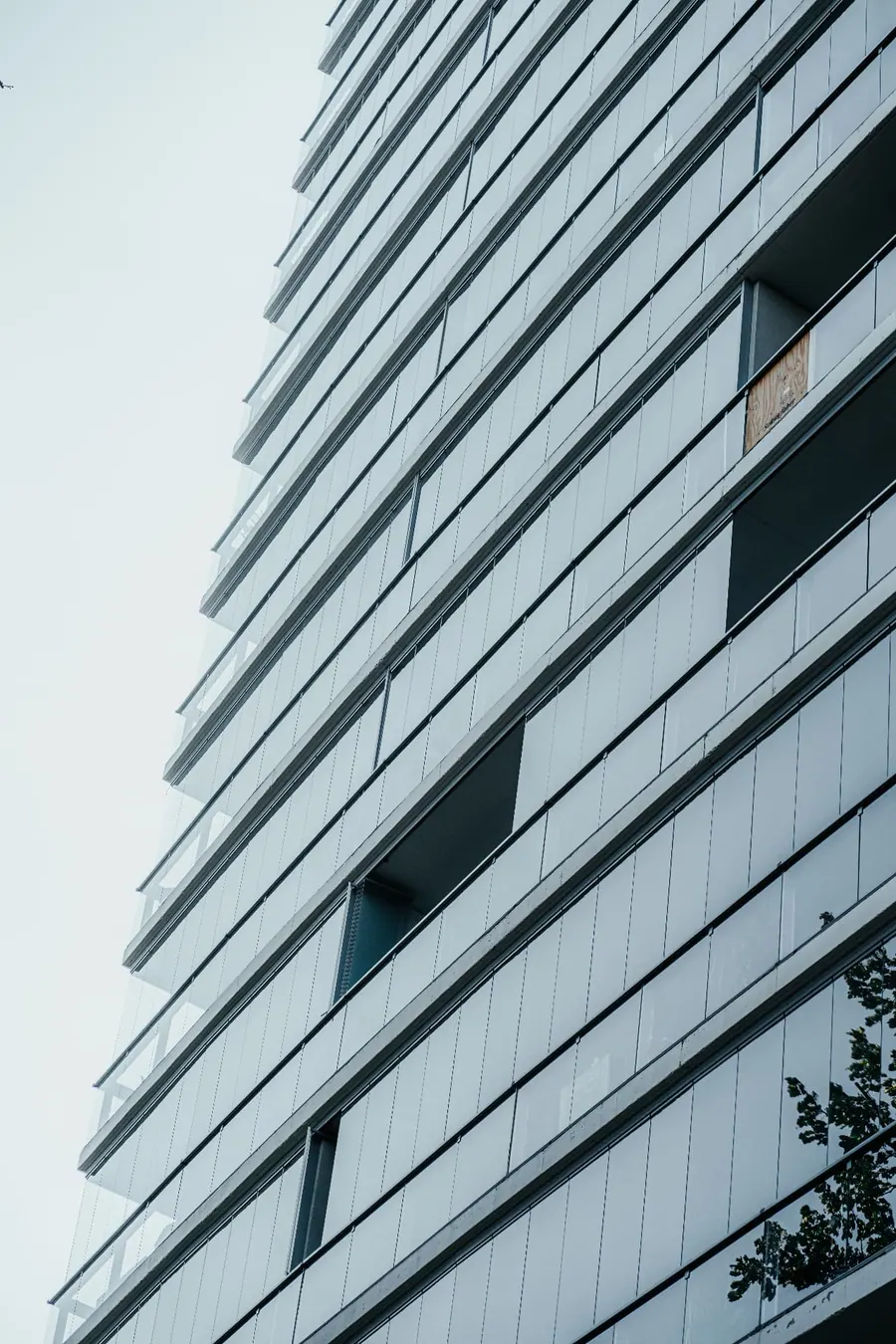 Lumon retractable glass panels installed across a multistory building exterior