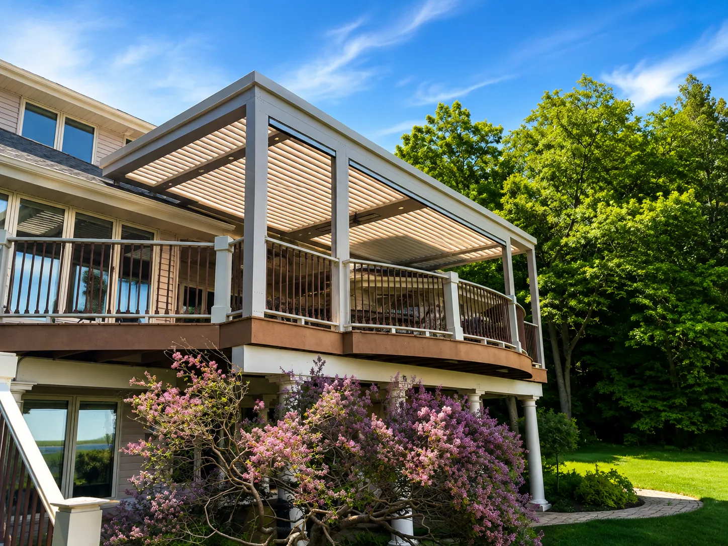 White louvered aluminum pergola shading a raised deck in Sturgeon Bay, Wisconsin
