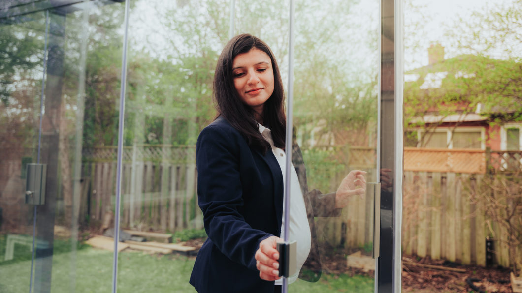 Backyard patio enclosed with frameless Lumon glass panels