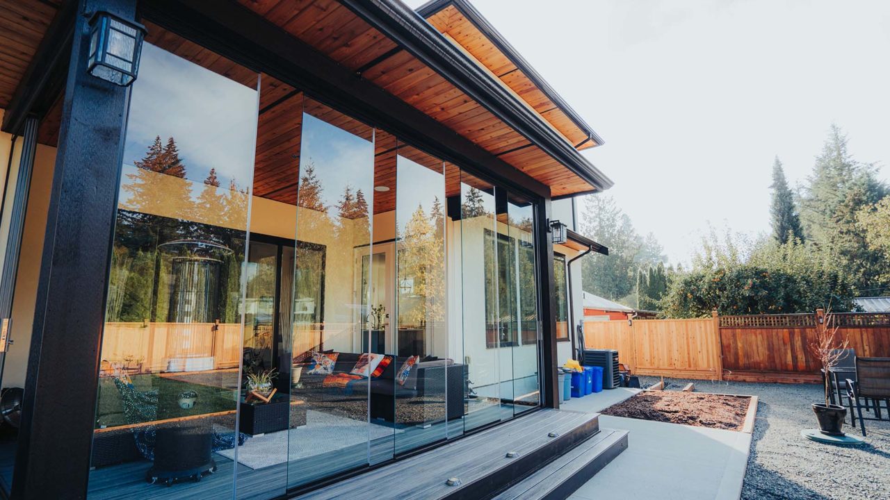 Lumon retractable glass walls enclosing a patio