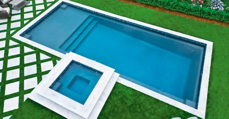 The Apex fiberglass pool design installed in a modern backyard