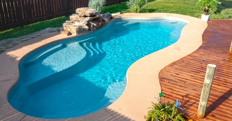 The Aria fiberglass pool design installed in a modern backyard