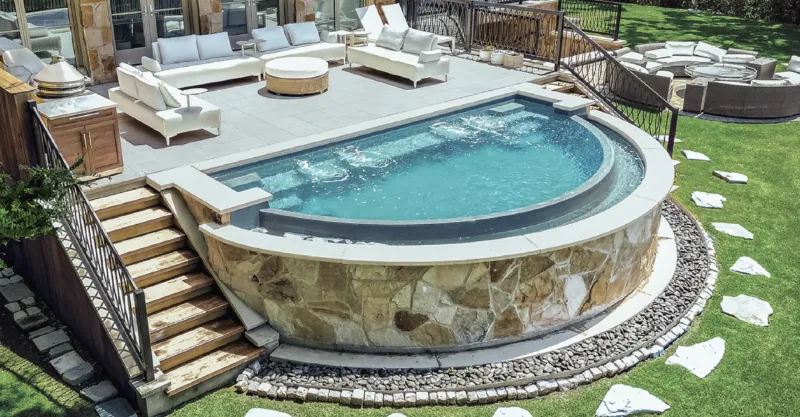 The Cosmopolitan fiberglass pool design installed in a modern backyard