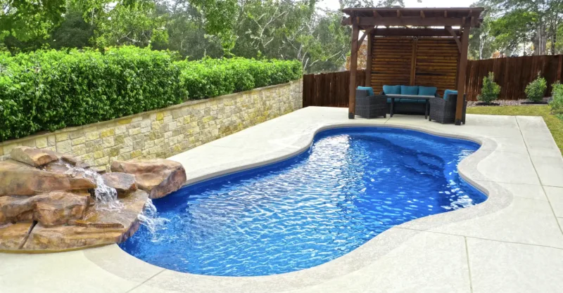 The Eden fiberglass pool design installed in a modern backyard