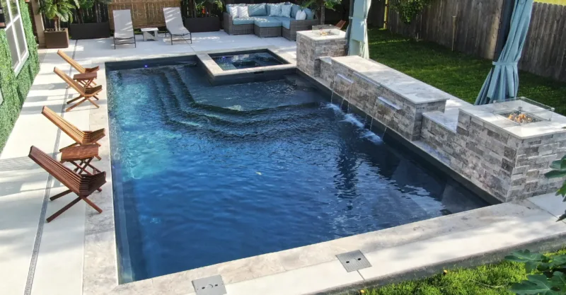 The Luxe fiberglass pool design installed in a modern backyard