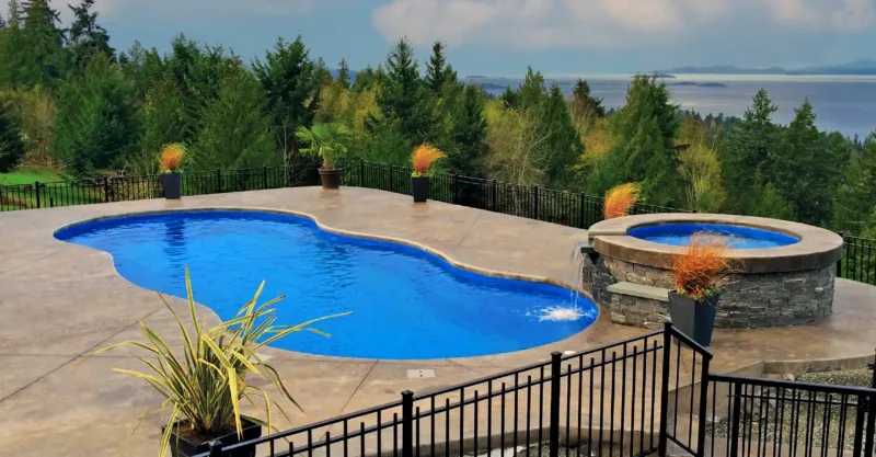 The Opus fiberglass pool design installed in a modern backyard