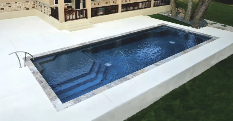 The Vogue fiberglass pool design installed in a modern backyard