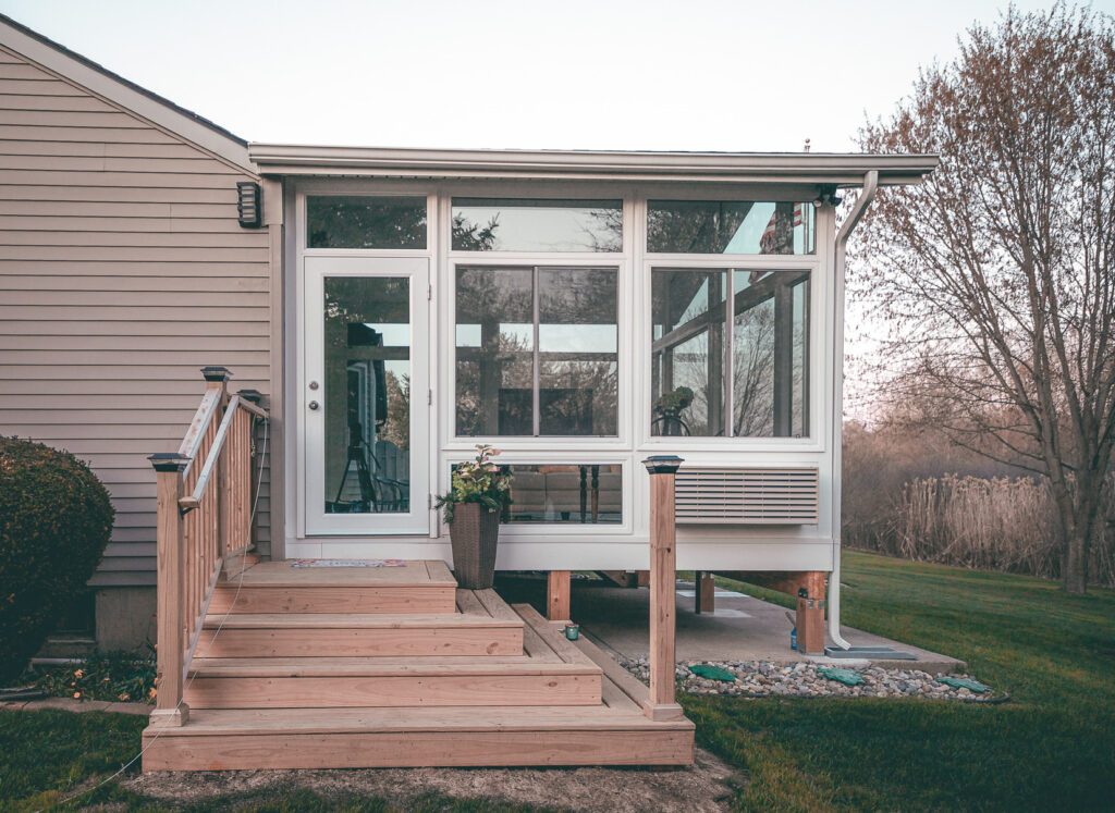 Sunroom dining space with sliding glass doors