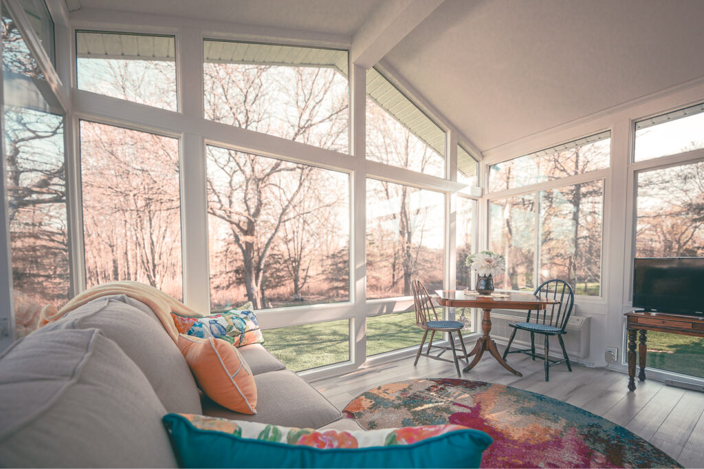 Four-season LivingSpace sunroom with full-height glass walls