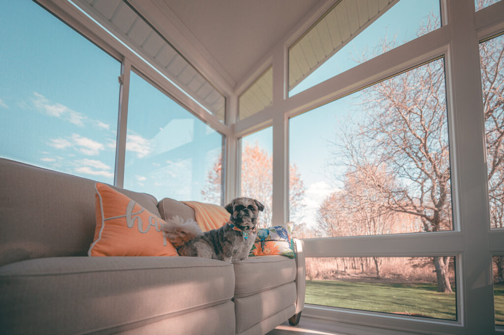 Sunroom interior with woodplank ceiling and recessed lighting